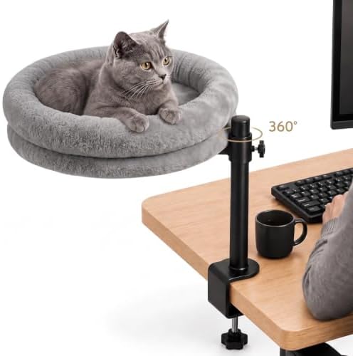 Matrindella cat desk bed in white, clamped to a desk edge with the semi-circular faux fur nest rotated toward the chair